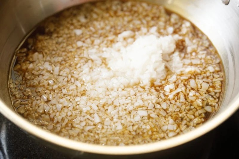 Jaggery syrup with cooked ada in pan.