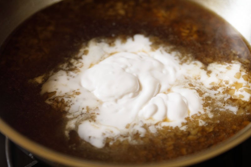 Thick coconut milk in pan.