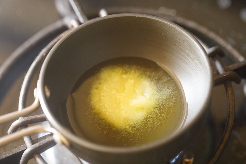 Ghee melting in a pan.