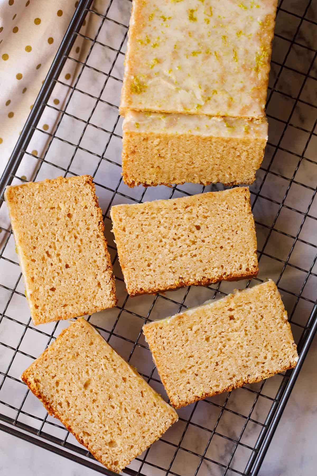 lemon cake sliced on a wired rack.